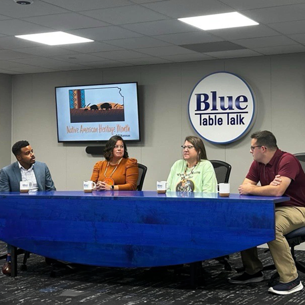 Four people discuss month at Blue Table Talk