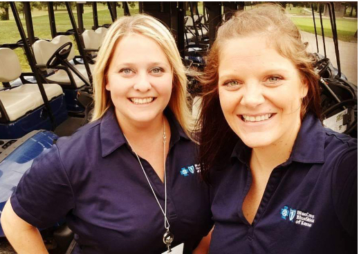 Two smiling Blue Cross and Blue Shield of Kansas employees
