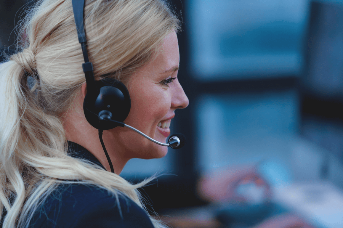 Blond woman talking on a headset