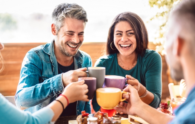 Couple having coffee with friends