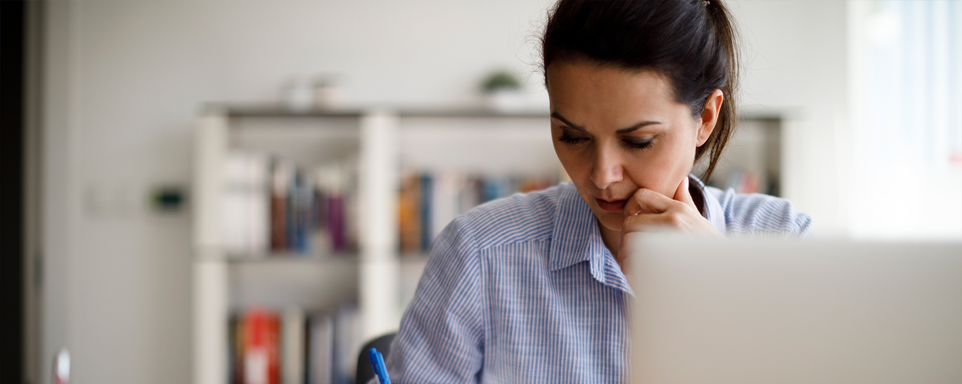 Woman writing down goals