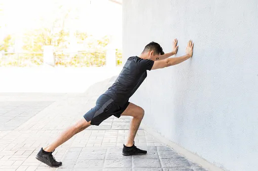 Man stretching calves