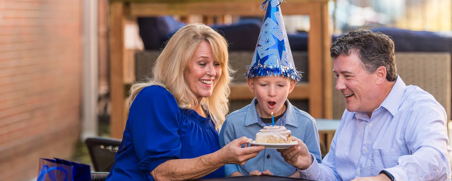 Child blowing out candle