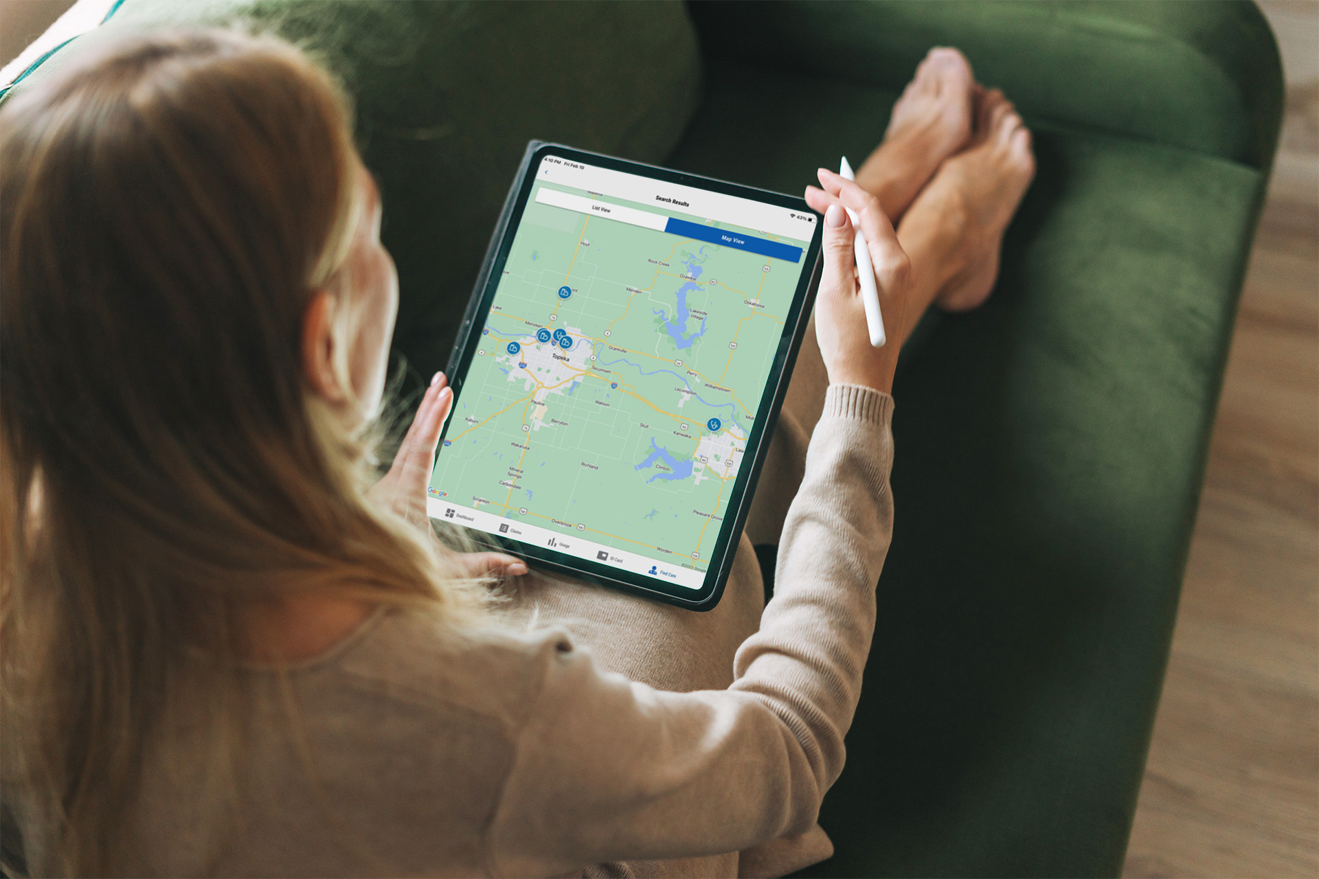 Woman views provider locations nearby on a map.