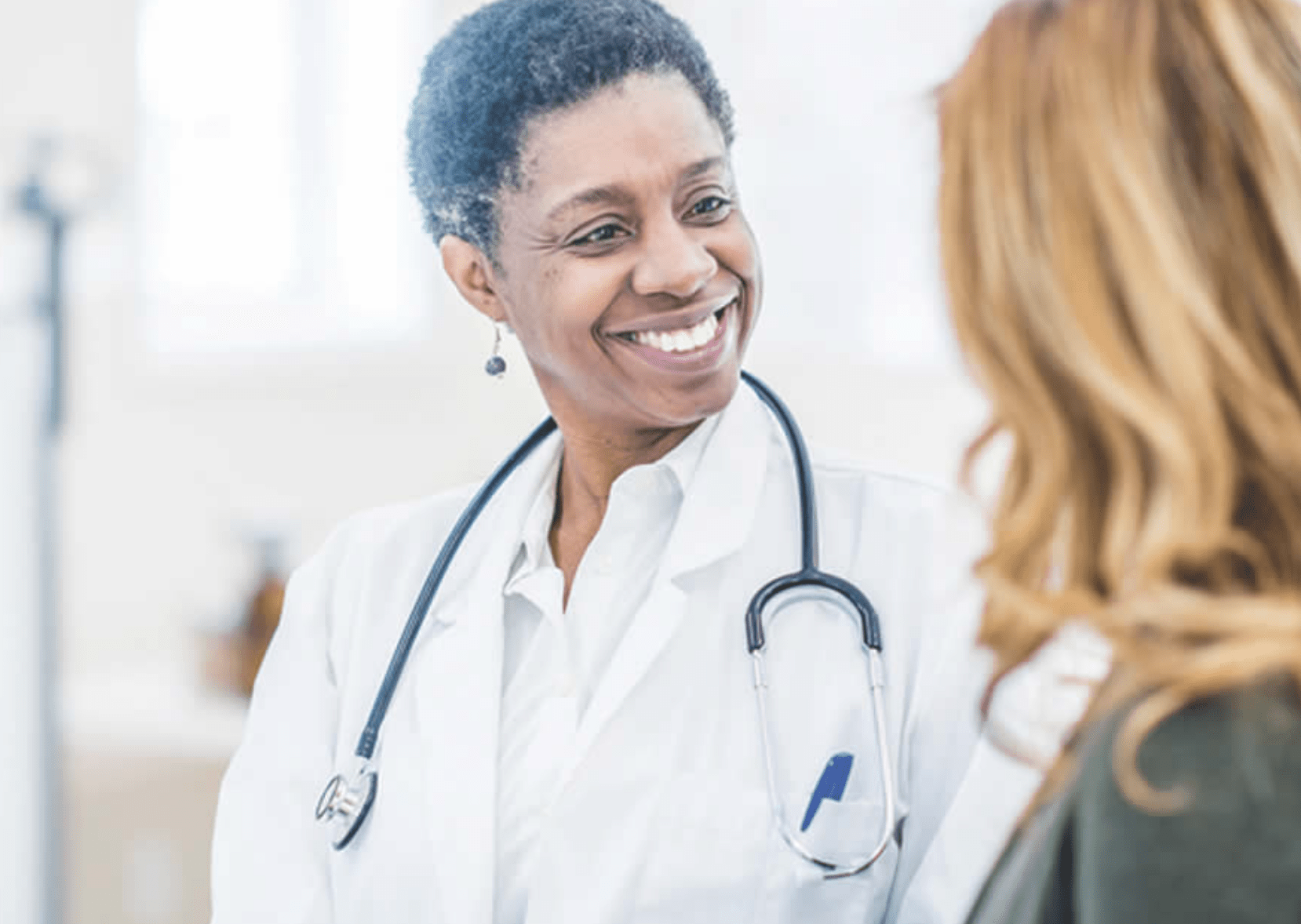A doctor talking with her patient