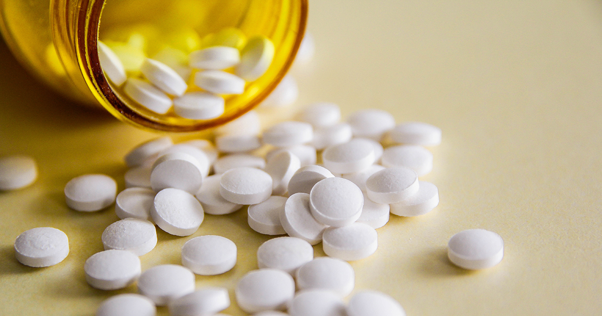 pills spilling out of a prescription bottle