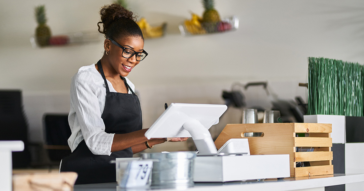 food service worker using a point of sale terminal