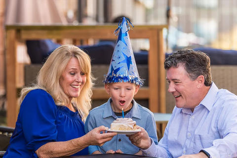 Child blowing out candle