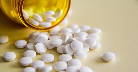 pills spilling out of a prescription bottle